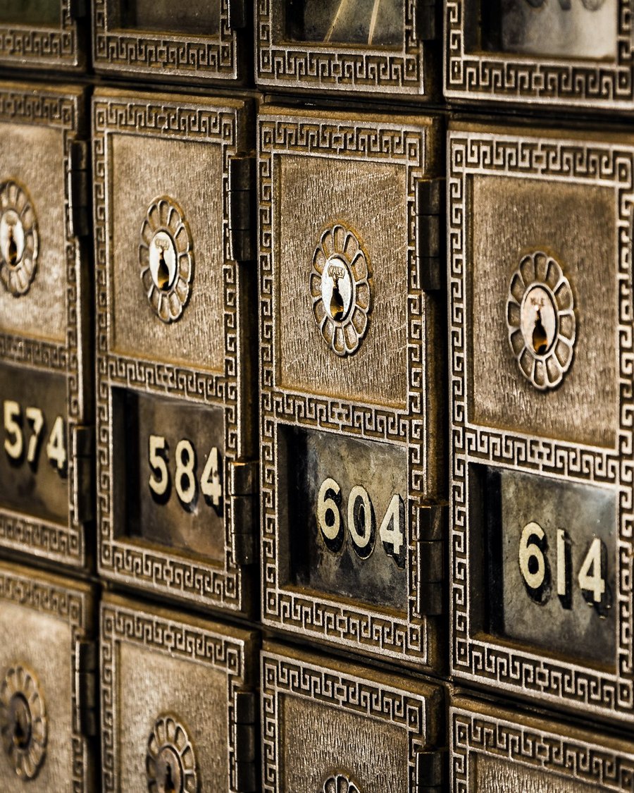 Rows of brass safe-deposit boxes