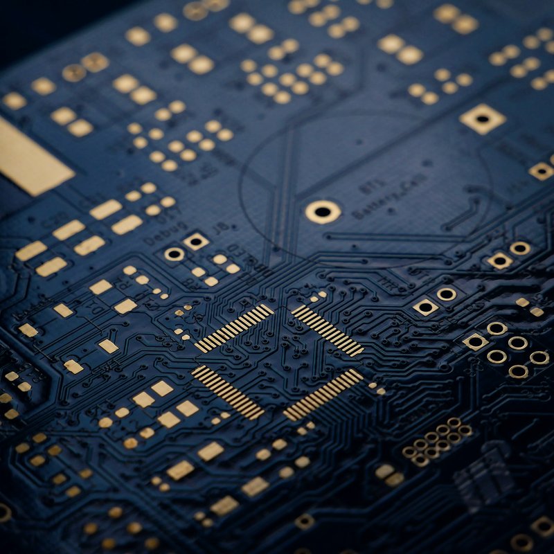 A close-up of a dark blue circuit board