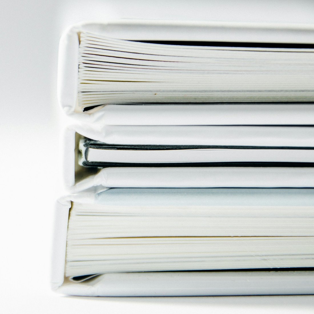 A stack of white binders